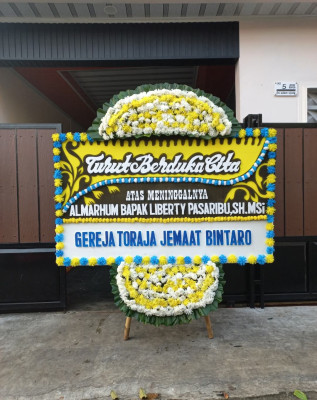 Papan Bunga Duka di Taban